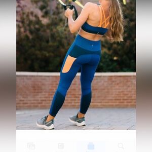 ZYIA Neon Orange Curve Pocket Light n Tight hi-rise legging.